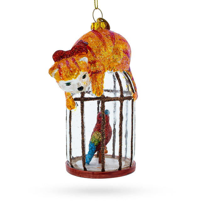 Glass Curious Cat Perched on Parrot Bird Cage - Sparkling Blown Glass Christmas Ornament in Yellow color