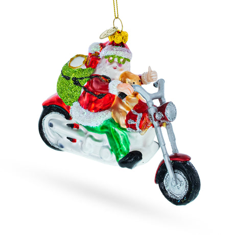 Glass Santa's Joyride: Scooter-Riding Santa - Blown Glass Christmas Ornament in Multi color