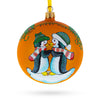 Glass Charming Penguin Couple Blown Glass Ball 'Our First Christmas' Ornament 4 Inches in Orange color Round