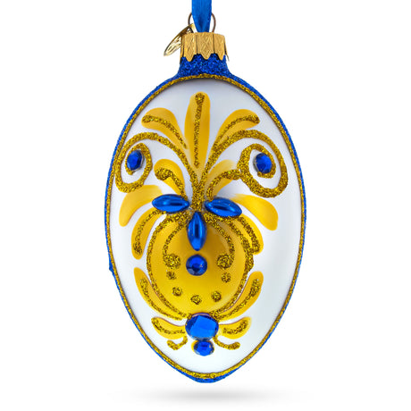 Bejeweled Gold on Blue Glass Egg Christmas Ornament 4 Inches in White color, Oval shape