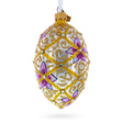 Glass Purple Flowers on Golden Scroll Glass Egg Christmas Ornament 4 Inches in White color Oval
