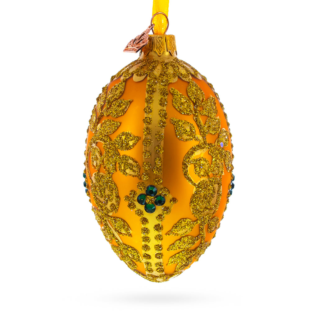 Glass Glittered Golden Leaves on Orange Glass Egg Ornament 4 Inches in Gold color Oval