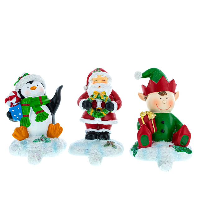 Resin Festive Trio: Set of 3 Christmas Stocking Holders - Elf, Santa, and Penguin in Multi color
