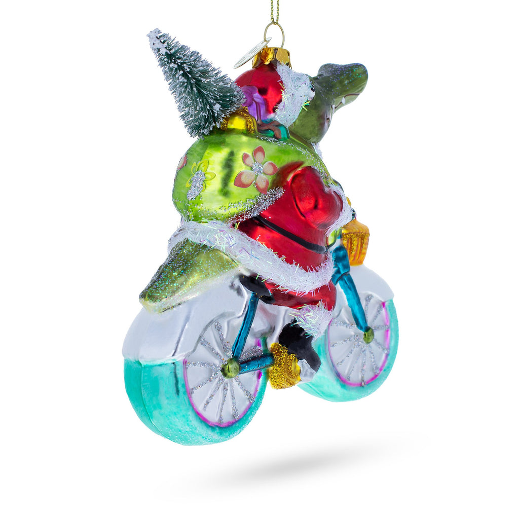 Alligator Riding Bicycle with Gifts Glass Christmas OrnamentChina , dimensions in inches: 5 x 4.45 x 2.05