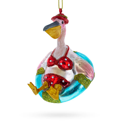 Vacationing Pelican in Swimsuit on an Inflatable Blown Glass Christmas Ornament in Green color