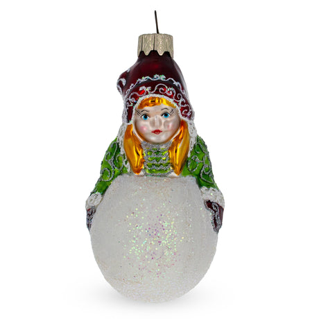 Girl Making a Snowball Glass Christmas Ornament in Multi color,  shape