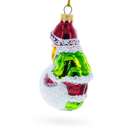 Girl Making a Snowball Glass Christmas OrnamentUkraine , dimensions in inches: 4.5 x 2.2 x 2.2
