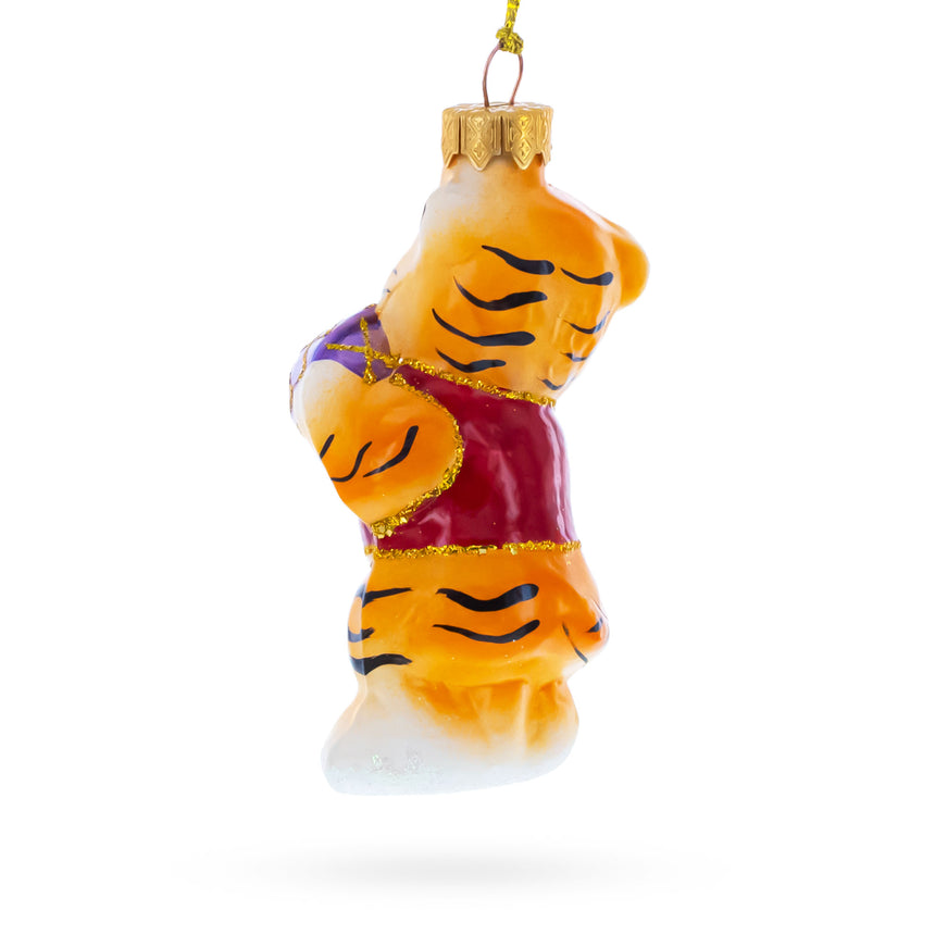 Tiger Cub with Ball Glass Christmas OrnamentUkraine , dimensions in inches: 4.3 x 1.8 x 1.5