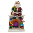 Santa Sitting on a Fireplace LED Lights Figurine 7.75 Inches in Red color