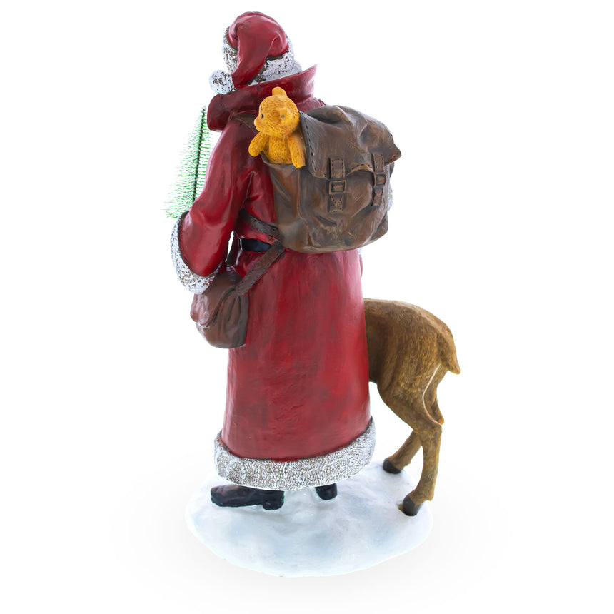 Shop Santa Holding Christmas Tree and Bell by Reindeer Figurine 12 Inches. Buy Christmas Decor Figurines Santa AL Red   for Sale by Online Gift Shop BestPysanky Santa Claus figurine decoration
