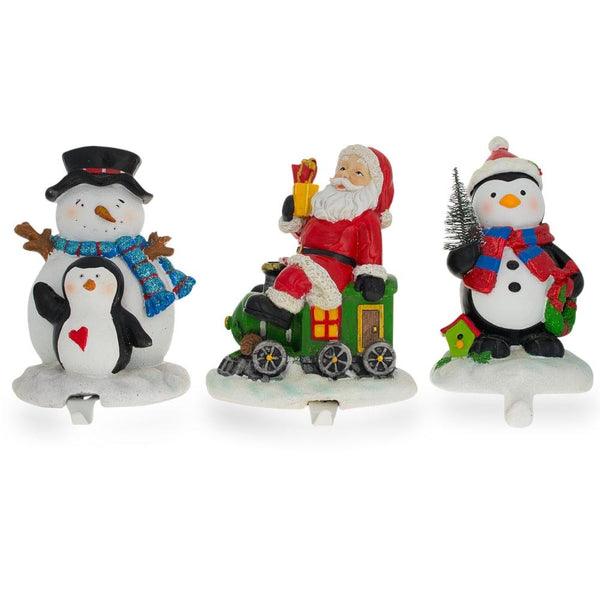 Set of 3 Hand Painted Stocking Holders - Penguin, Snowman & Santa 6.5 Inches in Multi color,  shape