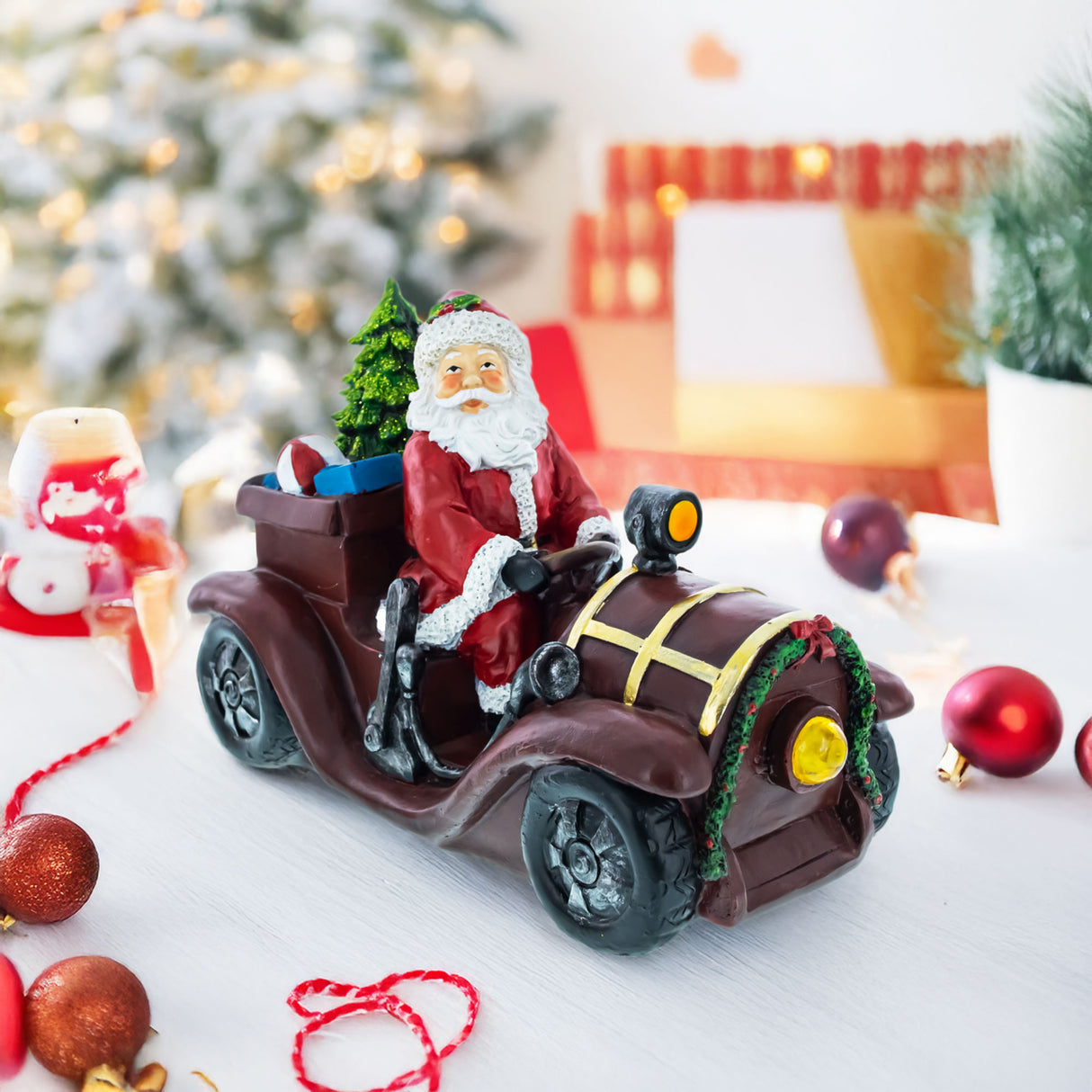 Resin Santa Driving Classic Car with LED Lights Figurine 10.5 Inches Long in Red color