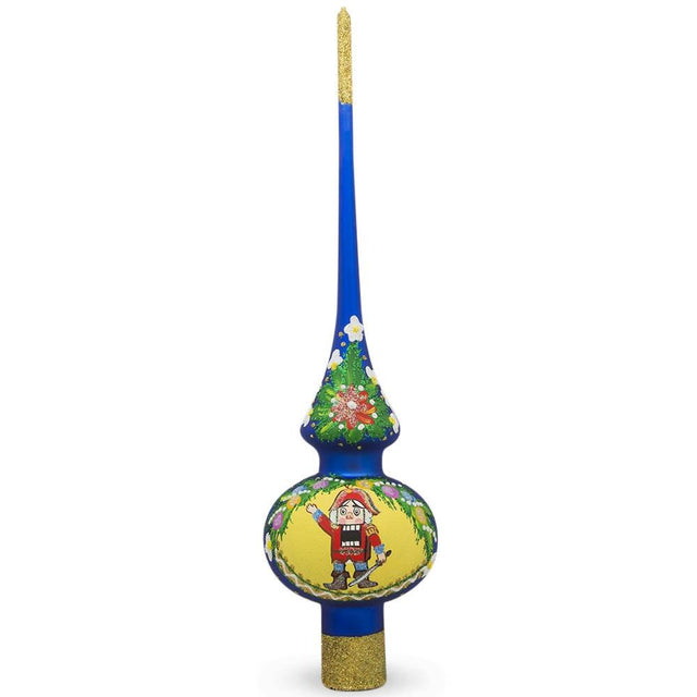 Nutcracker and Wreath on Blue Artisan Hand Crafted Mouth Blown Glass Christmas Tree Topper 11 Inches in Blue color, Triangle shape