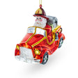 Heroic Santa Firefighter in Fireman Truck - Unique Blown Glass Christmas Ornament in Red color,  shape