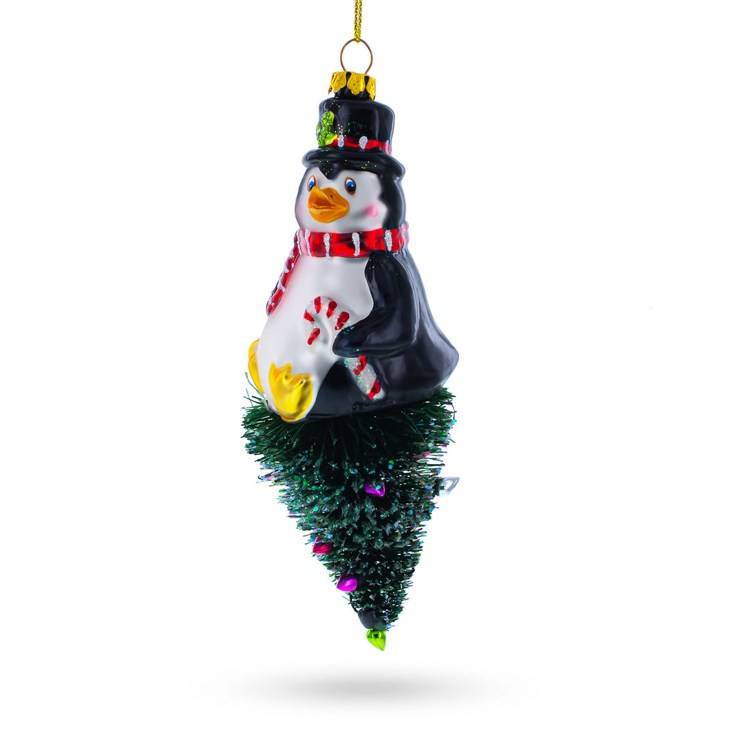 Glass Playful Penguin on Upside Down Tree - Handcrafted Blown Glass Christmas Ornament in Green color