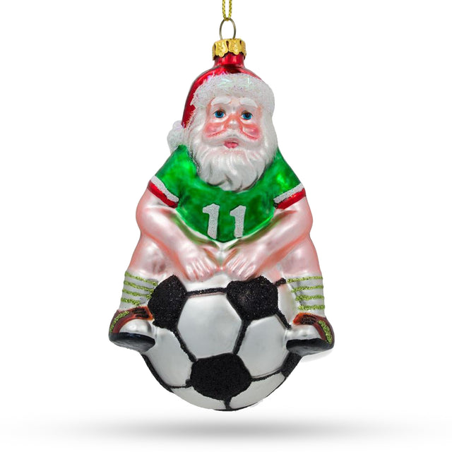 Festive Santa Seated on Soccer Ball - Blown Glass Christmas Ornament in Multi color,  shape
