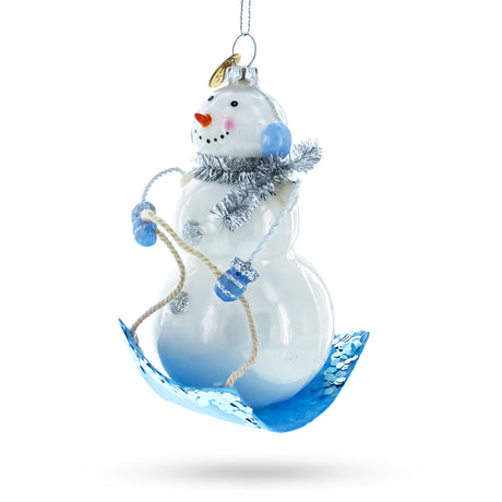 Glass Jovial Snowman Riding a Sled - Blown Glass Christmas Ornament in Blue color