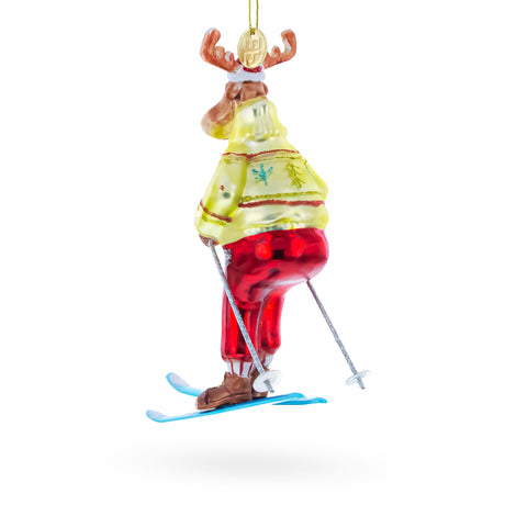 Festive Reindeer Skiing Blown Glass Christmas Ornament , dimensions in inches: 6.5 x 3.94 x 3.08
