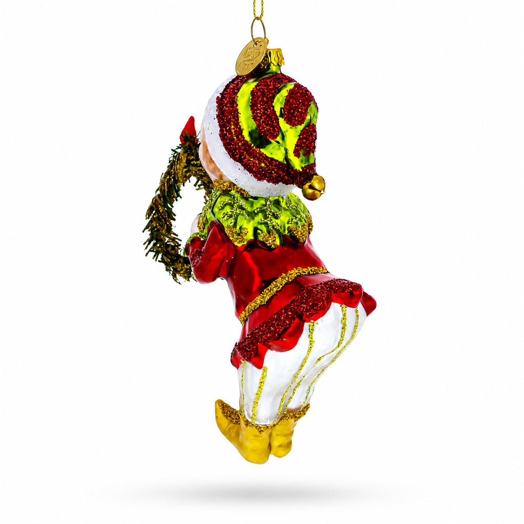 Smiling Elf with Red Bow Wreath Glass Christmas OrnamentChina , dimensions in inches: 3.94 x 3.75 x 3.75