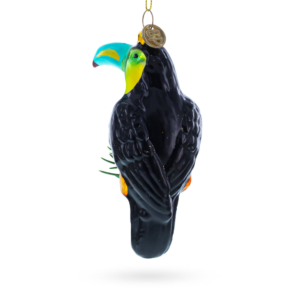Toucan with Pine Branch Glass Christmas OrnamentChina , dimensions in inches: 4.5 x 1.7 x 1.7