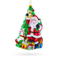 Santa’s Toyland Under the Tree Glass Christmas Ornament in Red color Figurine
