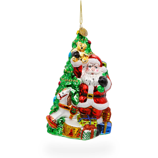 Jolly Santa by Tree - Blown Glass Christmas Ornament in Multi color, Triangle shape