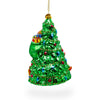 Jolly Santa by Tree - Blown Glass Christmas Ornament ,dimensions in inches: 6 x 3.6 x 3.9