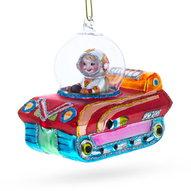 Astronaut in Space Vehicle Blown Glass Christmas Ornament in  color