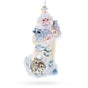 Santa Holding Cardinal and Raccoon Glass Christmas Ornament in White color