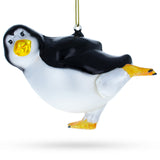 Glass Winter Waltz: Joyful Penguin Dancing - Blown Glass Christmas Ornament in Multi color