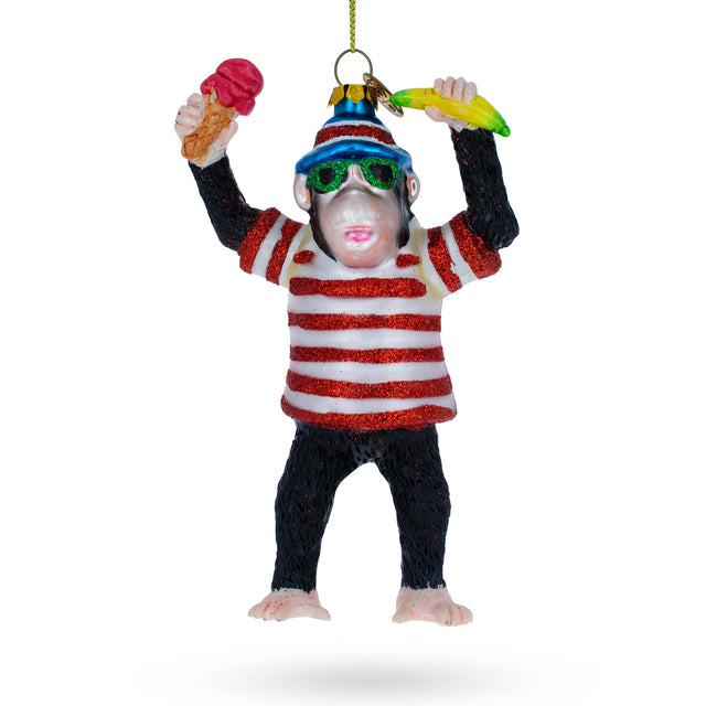 Jungle Indulgence: Whimsical Monkey with Banana and Ice Cream - Blown Glass Christmas Ornament in Multi color,  shape