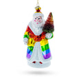 Rainbow-Clad Santa Holding a Christmas Tree - Blown Glass Christmas Ornament in Multi color,  shape