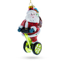 Santa Cruising on Electric Scooter Glass Christmas Ornament in Red color Figurine