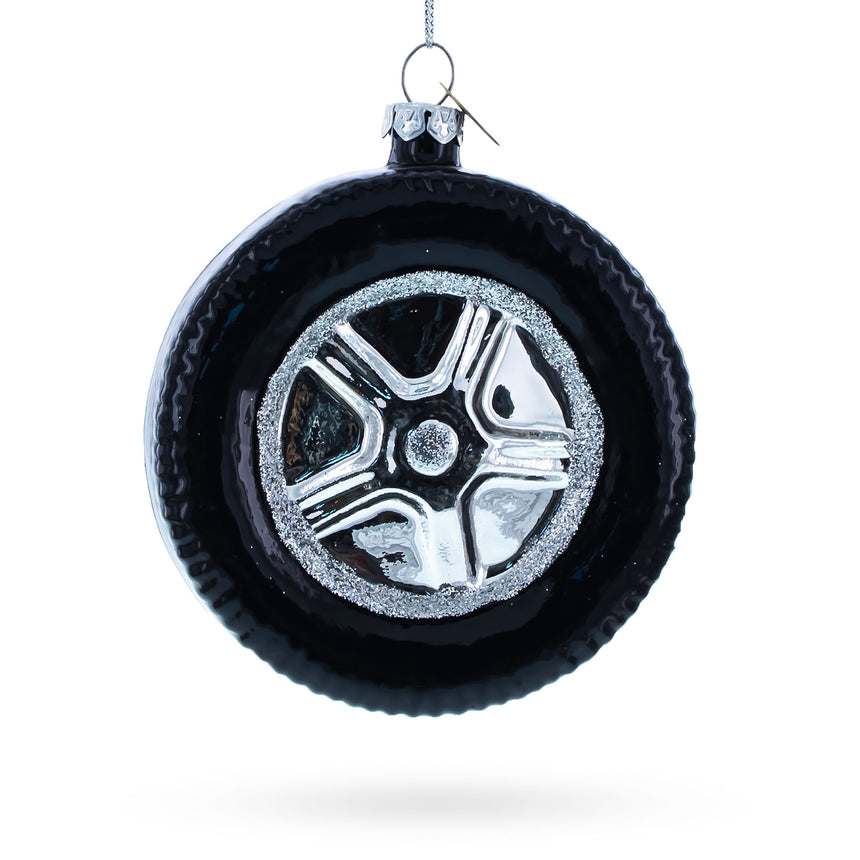 Sleek Black Car Wheel Blown Glass Christmas Ornament in Black color Round