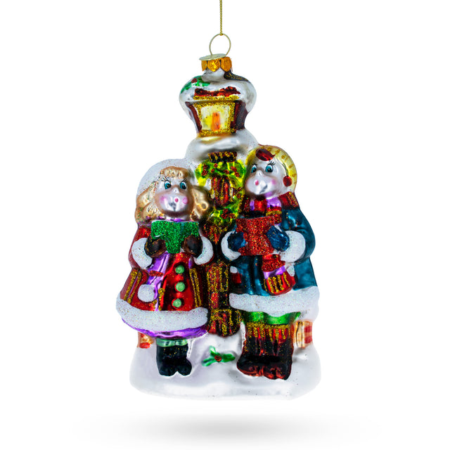 Glass Carolers by a Vintage Lantern Blown Glass Christmas Ornament in Multi color
