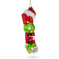 Noel Sign Topped with Santa Hat Large Glass Christmas Ornament in Multi color Figurine