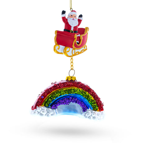 Whimsical Santa in Sleigh Over Rainbow Blown Glass Christmas Ornament in Multi color