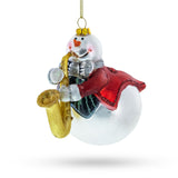 Jazzy Snowman Playing Saxophone Glass Christmas Ornament in  color