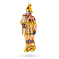 Heroic Fireman with Hose Glass Christmas Ornament in Orange color Figurine