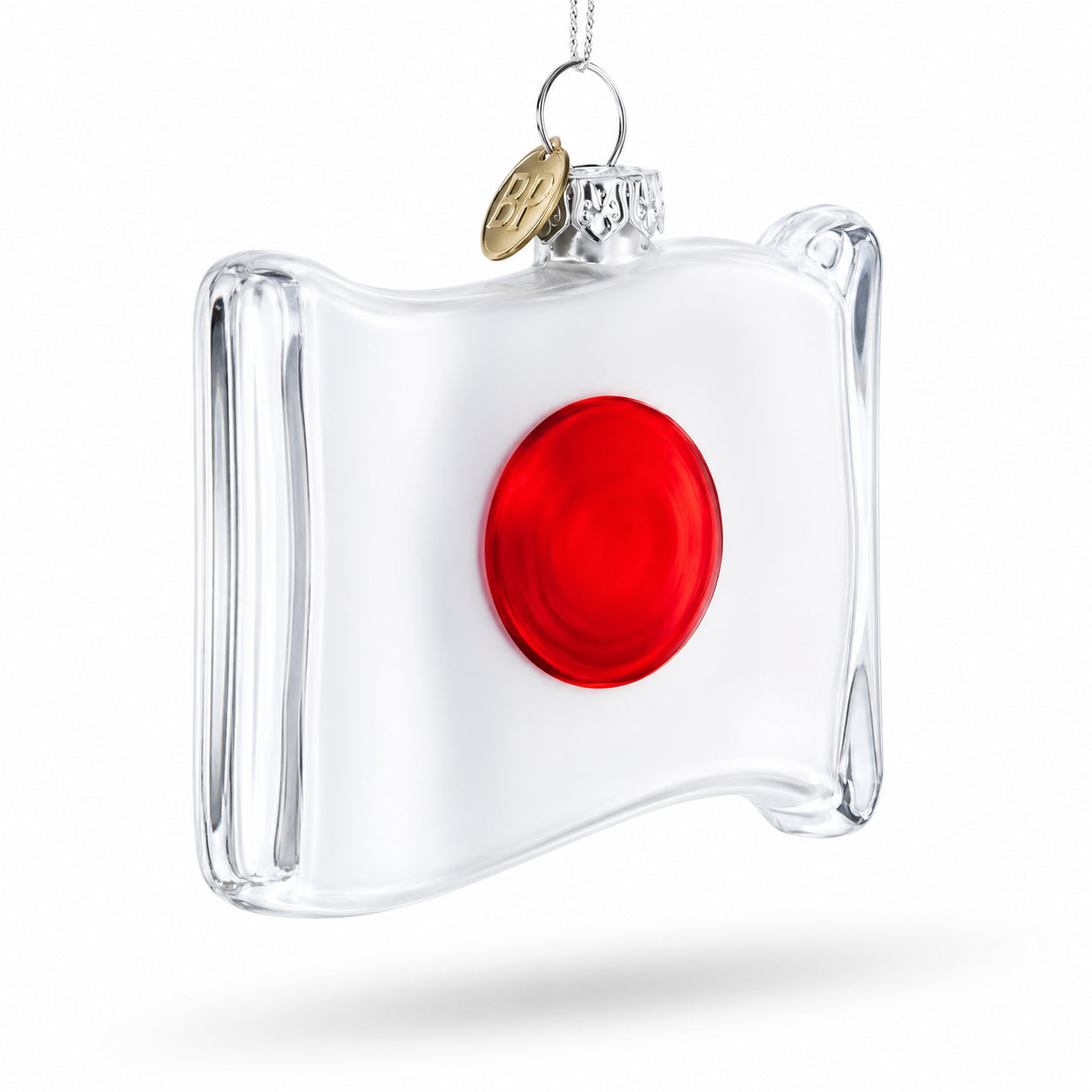 Waving Flag of Japan Glass Christmas OrnamentChina , dimensions in inches: 3.4 x 2.8 x 0.9