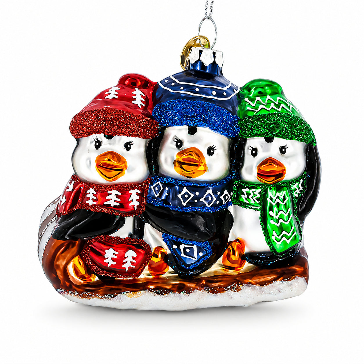 Penguin Trio Sledding Glass Christmas Ornament in Multi color Figurine