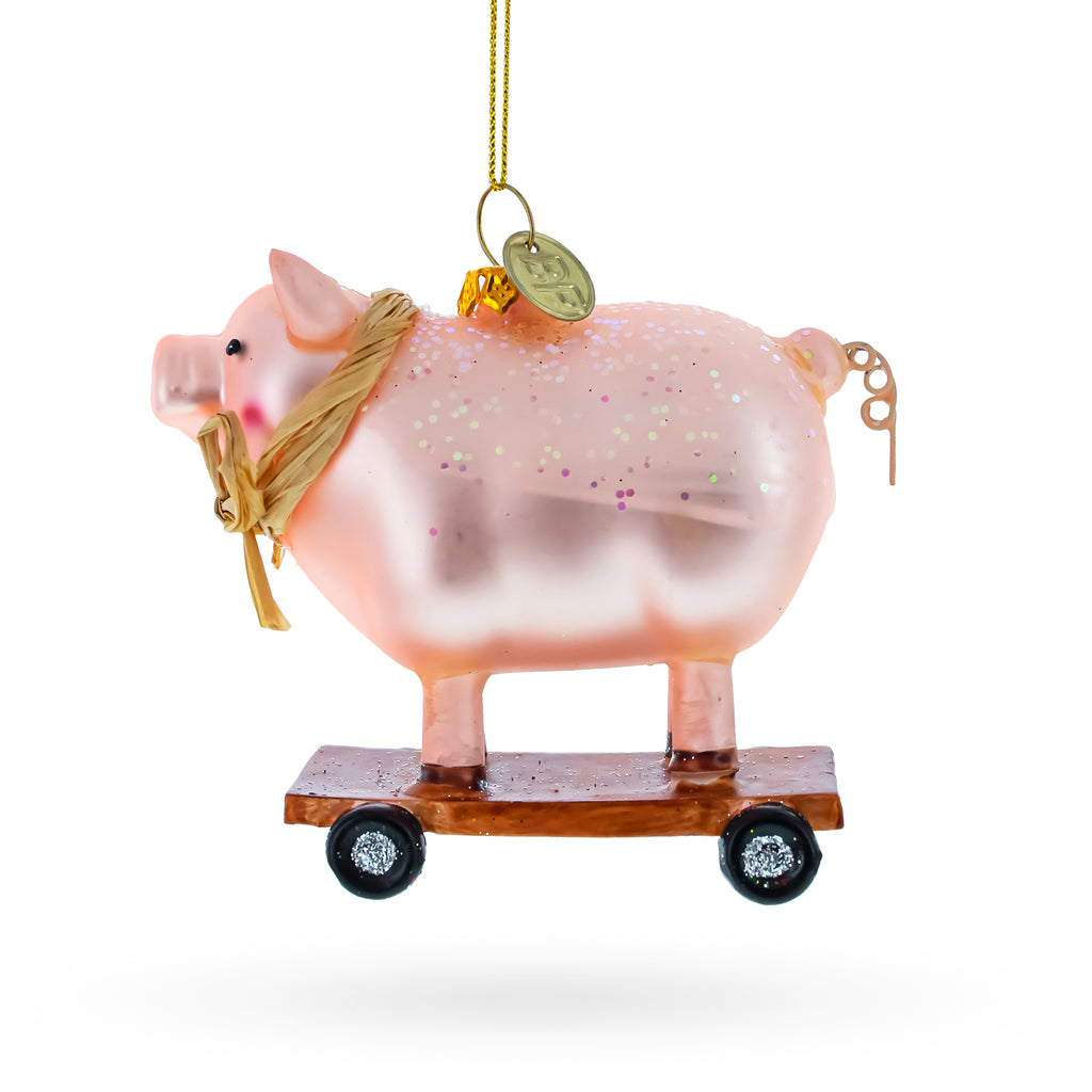 Playful Pig Riding a Skateboard Glass Christmas Ornament in Pink color Figurine
