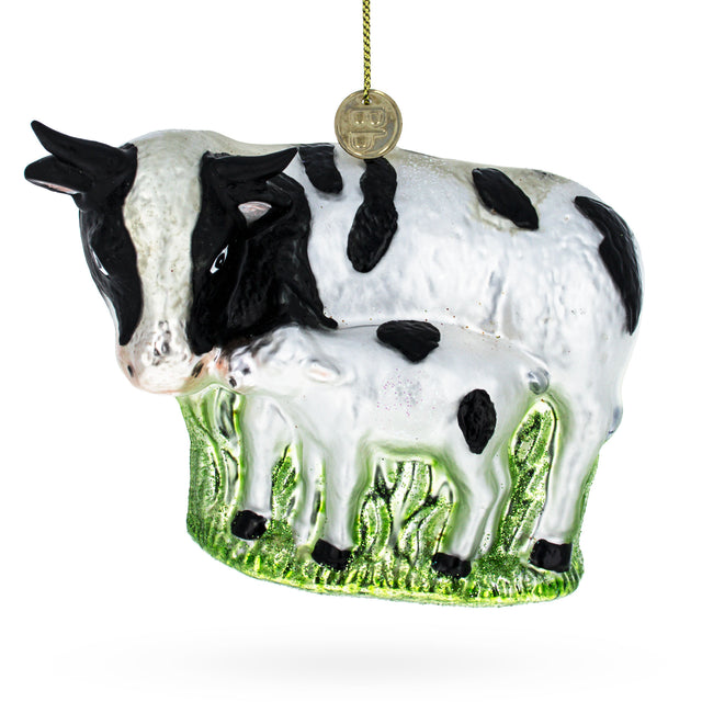 Nurturing Cow with Calf Blown Glass Christmas Ornament in Multi color