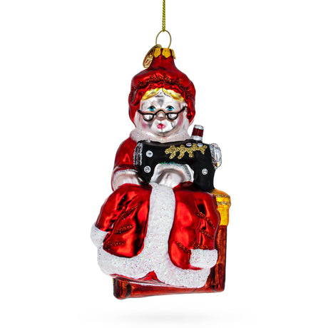 Diligent Mrs. Claus and Sewing Machine Blown Glass Christmas Ornament in Red color