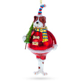 Dog in Fur Hat Holding Tree Blown Glass Christmas Ornament in Red color