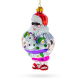 Santa Lounging in a Unicorn Floatie - Blown Glass Christmas Ornament in Multi color,  shape