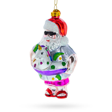 Glass Santa Lounging in a Unicorn Floatie - Blown Glass Christmas Ornament in Multi color