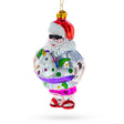 Santa Lounging in a Unicorn Floatie Glass Christmas Ornament in Multi color