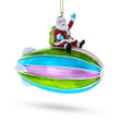 Santa's Sky-High Voyage: Santa Riding Aerostat Blimp - Blown Glass Christmas Ornament in Multi color,  shape