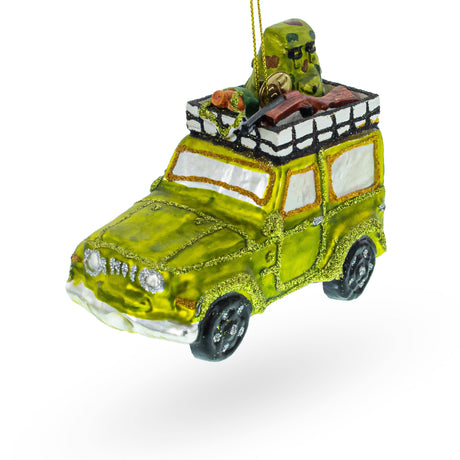 Camouflaged Hunter in a Car Blown Glass Christmas Ornament in Green color